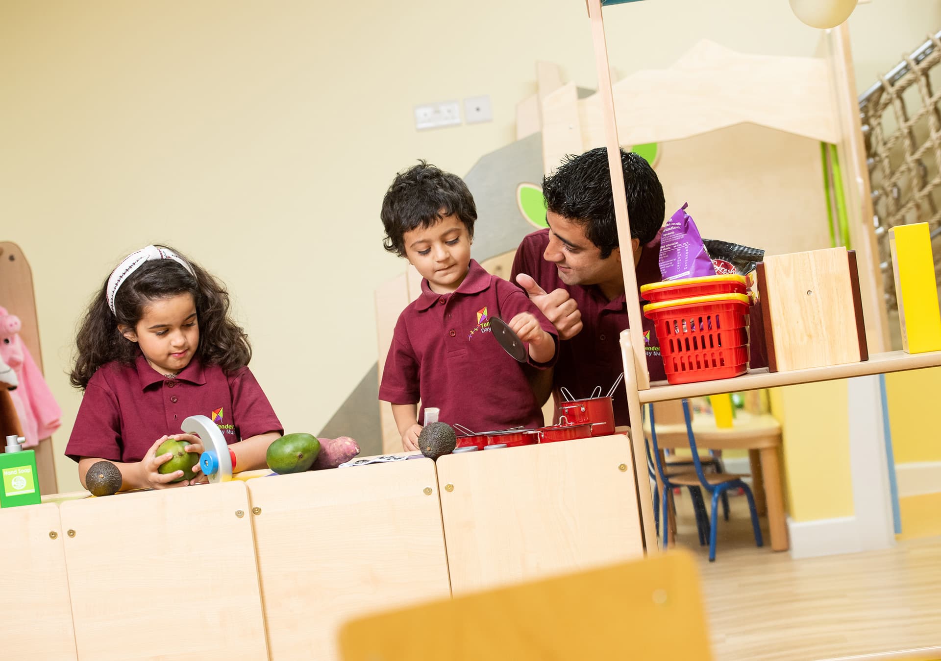 Children and a staff member playing at a role play shop